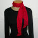 This scarf can be tied multiple different ways. Because it's nice and long at 66 inches, the fabric falls nicely.
